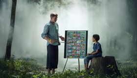 School Teaching local boy in rural area of Cambodia